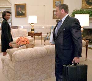 Condoleezza Rice and George Tenet in the White House. This picture is actually taken on October 8, 2001, and President Bush is elsewhere in the room.
